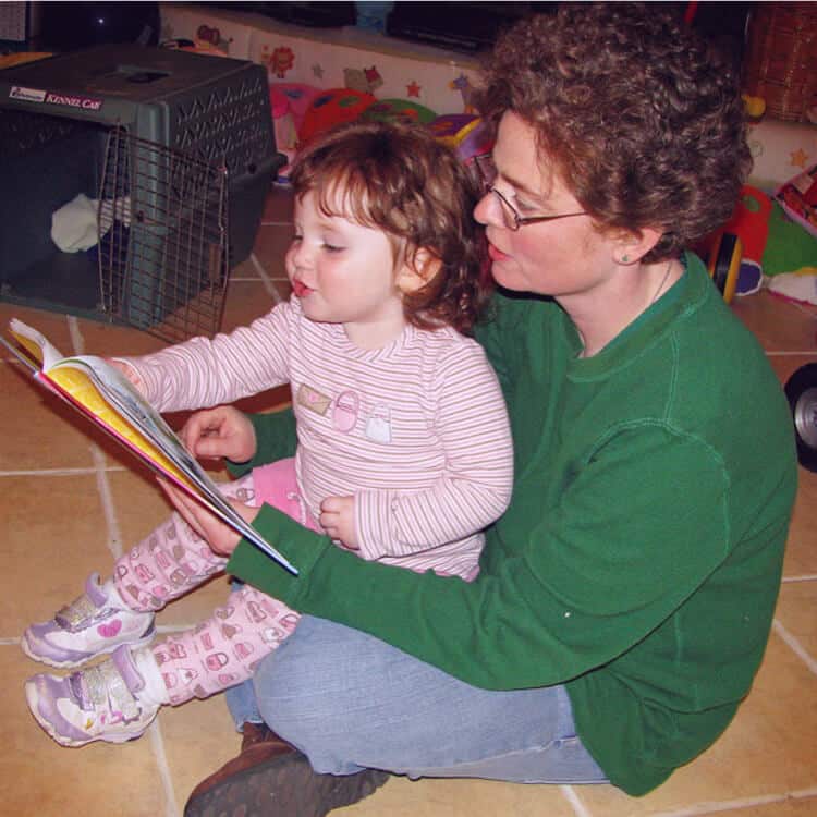 Mom reading to daughter