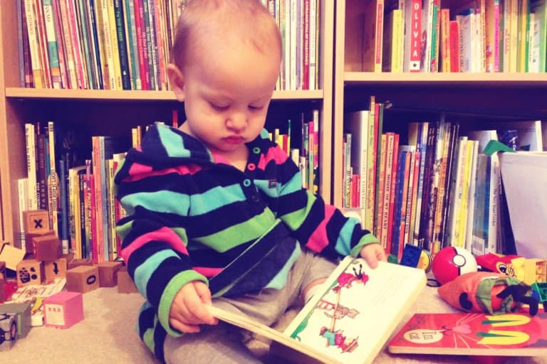 Young child reading nursery rhymes