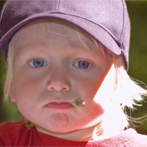 A child with something in his mouth for chewing