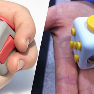 Two different fidget cubes in the palm of your hand