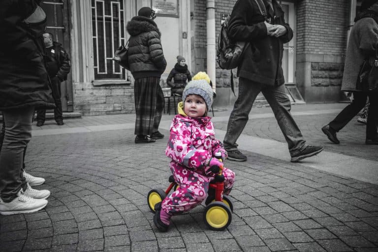 A child with autism on a tricycle